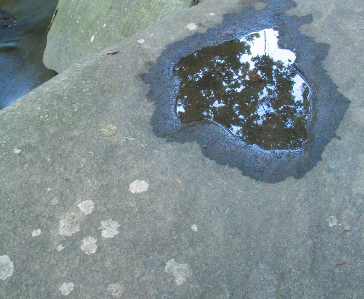 Reflection in the water on a rock at Saint Peter's Village
        Image © Frederick Monsimer